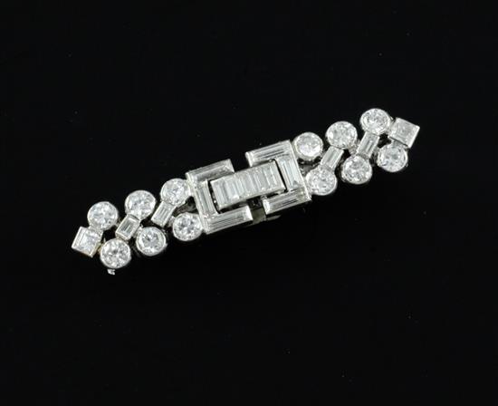 A mid 20th century Cartier platinum and diamond bar brooch, 36mm.